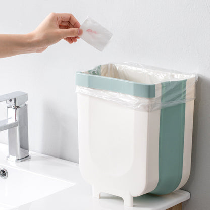 Sammenklappelig skraldespand til skabslåge